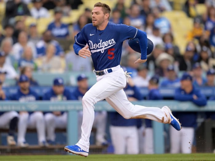 Apr 4, 2022; Los Angeles, California, USA; Los Angeles Dodgers first baseman Freddie Freeman (5) scores a run from third base in the first inning against the Los Angeles Angels at Dodger Stadium.